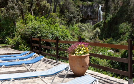 Pool terraces and the cascade as backdrop